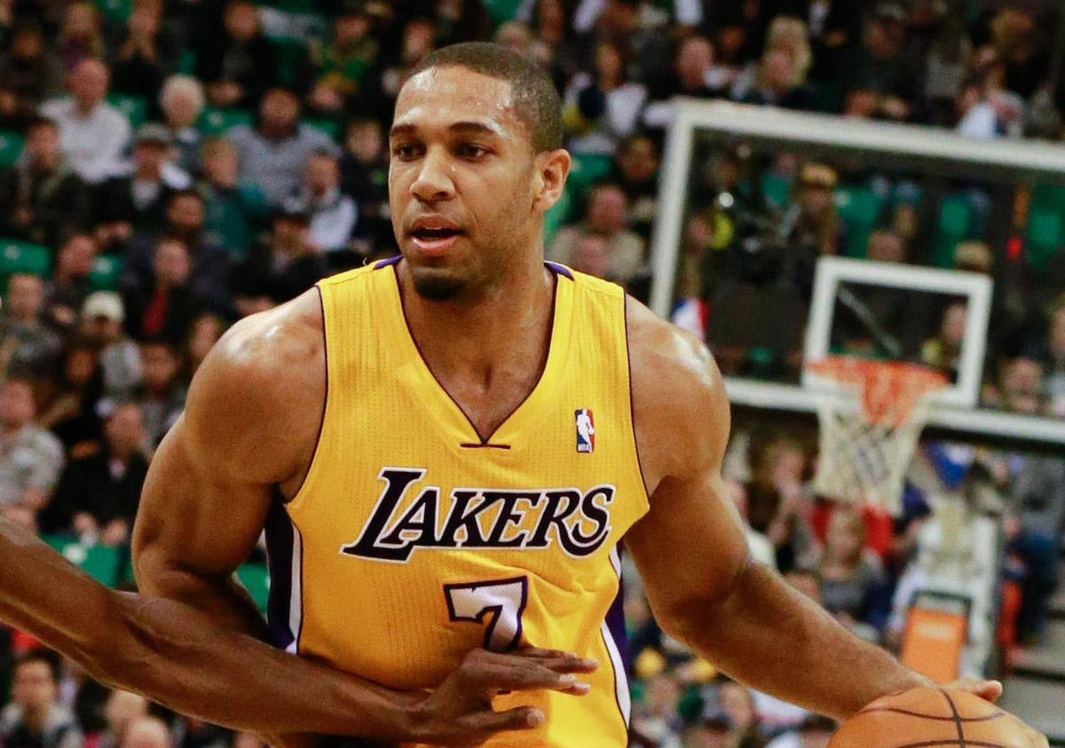 Dec 27, 2013; Salt Lake City, UT, USA; Los Angeles Lakers small forward Xavier Henry (7) brings the ball up the court while being guarded by Utah Jazz small forward Jeremy Evans (40) during the second quarter at EnergySolutions Arena. Mandatory Credit: Chris Nicoll-USA TODAY Sports