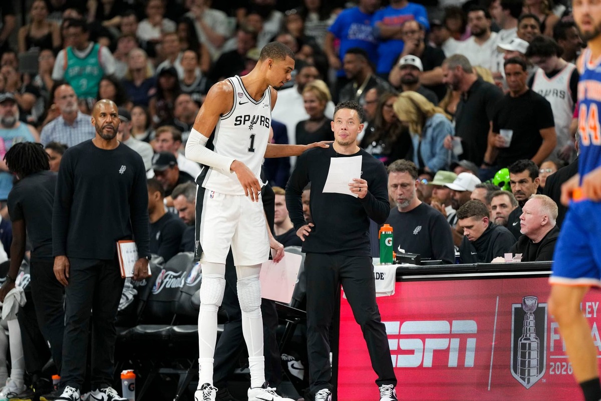  San Antonio Spurs forward Victor Wembanyama (1) talks with head coach Mitch Johnson during the 2026 NBA Finals at Frost Bank Center. Scott Wachter-Imagn Images