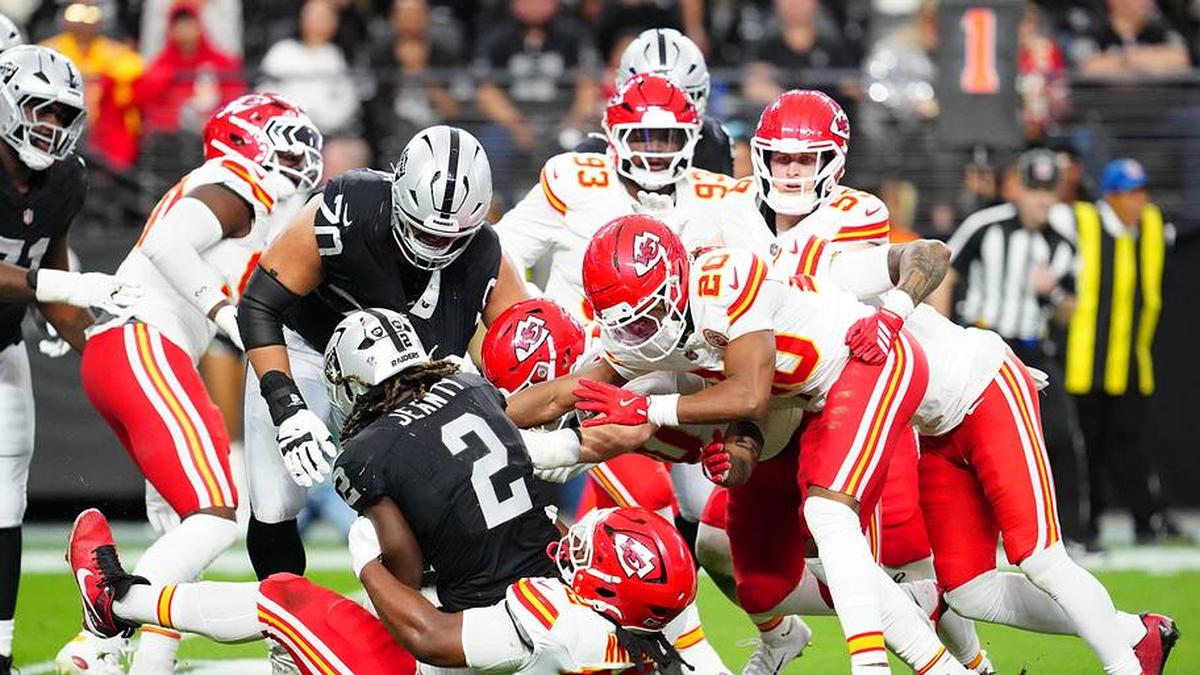  Jan 4, 2026; Paradise, Nevada, USA; Las Vegas Raiders running back Ashton Jeanty (2) is tackled by Kansas City Chiefs defensive tackle Derrick Nnadi (92) during the second quarter at Allegiant Stadium. Mandatory Credit: Stephen R. Sylvanie-Imagn Images | Stephen R. Sylvanie-Imagn Images 