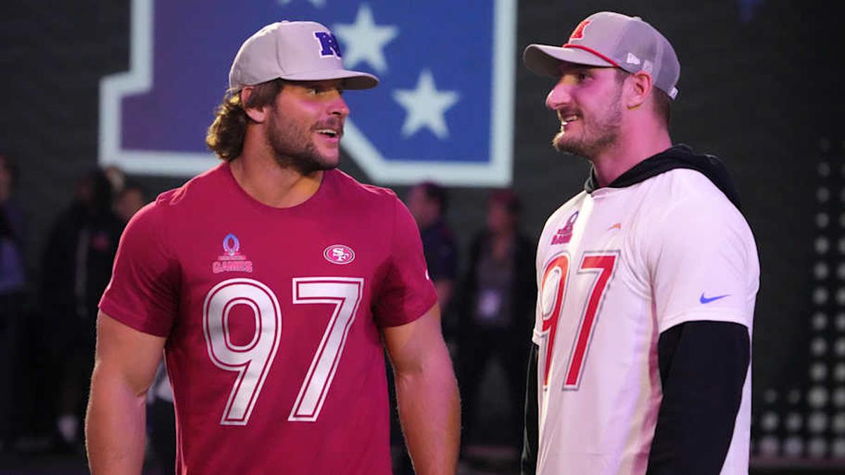  Jan 30, 2025; Orlando, FL, USA; NFC defensive end Nick Bosa of the San Francisco 49ers (left) with brother and AFC linebacker Joey Bosa during the Pro Bowl Skills Challenge at Nicholson Fieldhouse. Mandatory Credit: Kirby Lee-Imagn Images | Kirby Lee-Imagn Images 