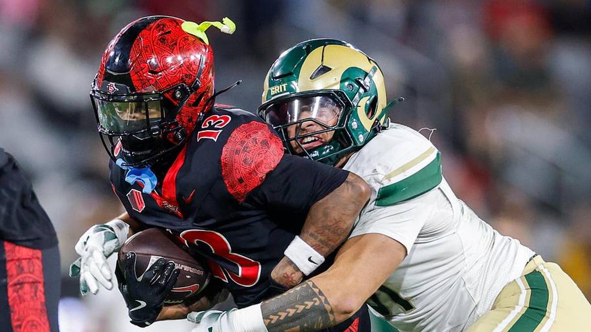  Oct 3, 2025; San Diego, California, USA; Colorado State Rams defensive lineman Caden Branston (93) tackles San Diego State Aztecs wide receiver Nathan Acevedo (13) during the second half at Snapdragon Stadium. Mandatory Credit: David Frerker-Imagn Images | David Frerker-Imagn Images 