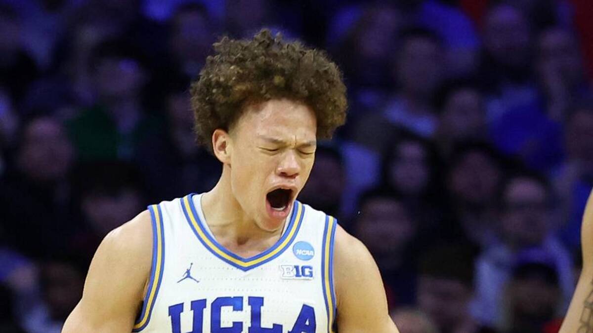  Mar 20, 2026; Philadelphia, PA, USA; UCLA Bruins guard Trent Perry (0) reacts with guard Eric Freeny (8) in the second half during a first round game of the men's 2026 NCAA Tournament at Xfinity Mobile Arena. Mandatory Credit: Bill Streicher-Imagn Images | Bill Streicher-Imagn Images 