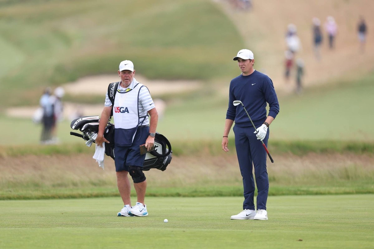  Jun 18, 2026; Southampton, New York, USA; Ben James prepares for his shot on the first green during the first round of the U.S. Open golf tournament. Mandatory Credit: Bill Streicher-Imagn Images
