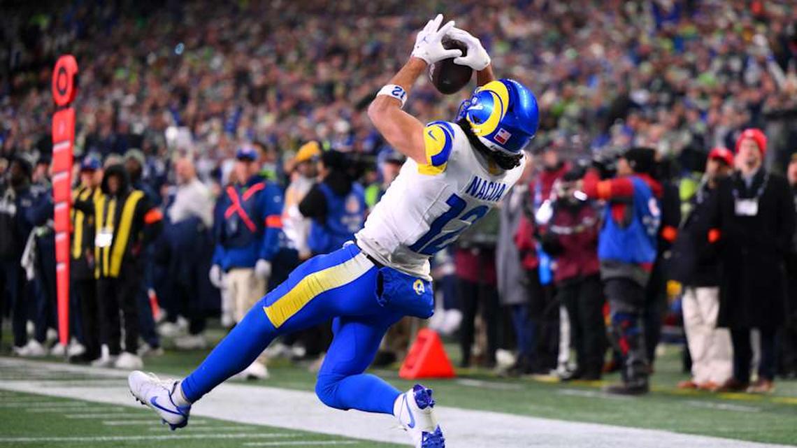  Jan 25, 2026; Seattle, WA, USA; Los Angeles Rams wide receiver Puka Nacua (12) scores a touchdown against the Seattle Seahawks during the second half in the 2026 NFC Championship Game at Lumen Field. Mandatory Credit: Steven Bisig-Imagn Images | Steven Bisig-Imagn Images 