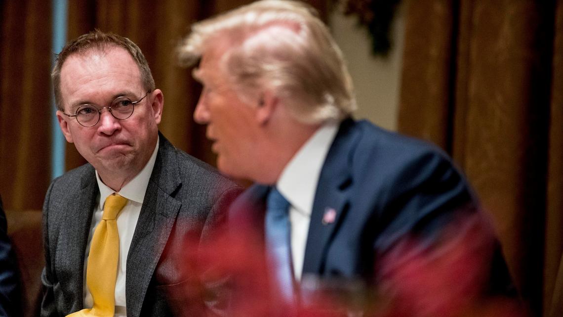 FILE - In this Thursday, Dec. 5, 2019, file photo, then-acting chief of staff Mick Mulvaney, left, listens to President Donald Trump, right, speak at a luncheon with members of the United Nations Security Council in the Cabinet Room at the White House in Washington. Republicans are coming to grips with the fallout of Trump’s false attacks on the election, which fueled the anger of supporters who stormed the U.S. Capitol on Jan. 6, 2021. Mulvaney says he never thought people would take the president’s words so literally. (AP Photo/Andrew Harnik, File)