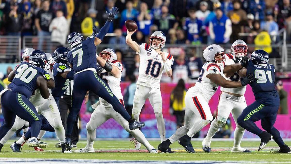  Feb 8, 2026; Santa Clara, CA, USA; New England Patriots quarterback Drake Maye (10) throws a pass under pressure from Seattle Seahawks linebacker Uchenna Nwosu (7) during Super Bowl LX at Levi's Stadium. Mandatory Credit: Mark J. Rebilas-Imagn Images | Mark J. Rebilas-Imagn Images 