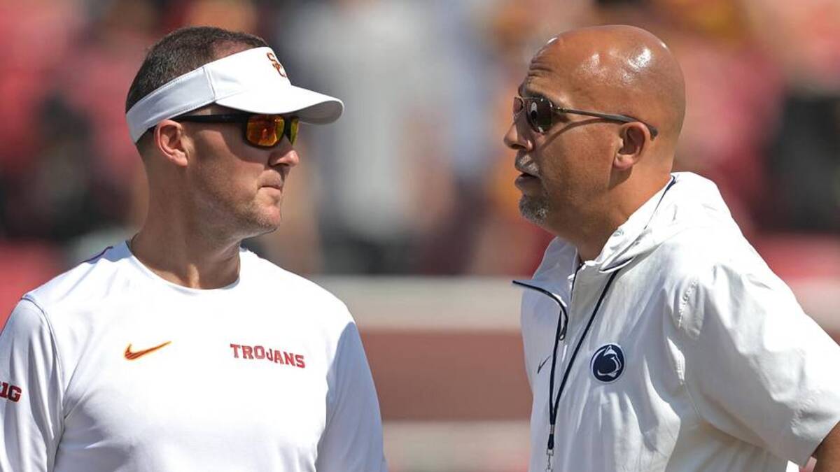  Oct 12, 2024; Los Angeles, California, USA; USC Trojans head coach Lincoln Riley, left, talks with Penn State Nittany Lions head coach James Franklin on the field prior to the game at United Airlines Field at Los Angeles Memorial Coliseum. Mandatory Credit: Jayne Kamin-Oncea-Imagn Images | Jayne Kamin-Oncea-Imagn Images 