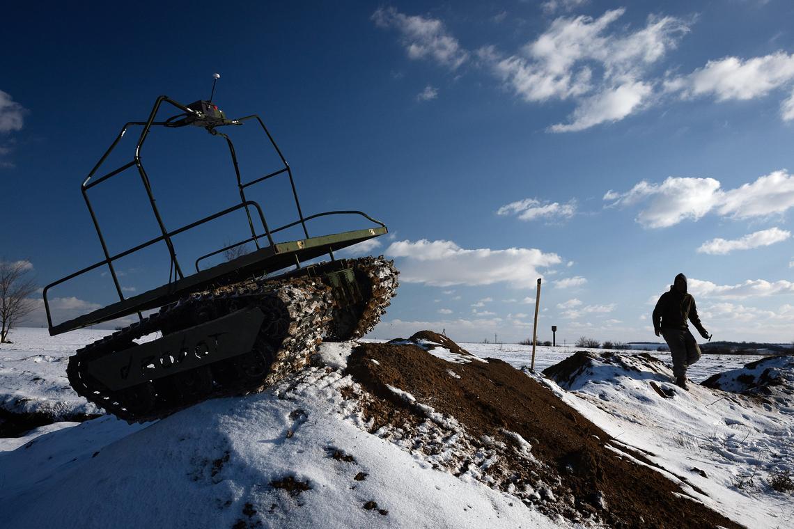 FILE -- A Ukrainian soldier practices with an unmanned vehicle in the Donbas region of eastern Ukraine, Feb. 21, 2025. Ukraine is using unmanned ground vehicles armed with bombs, guns or rockets to carry out attacks and keep its soldiers out of harm's way. (Tyler Hicks/The New York Times)