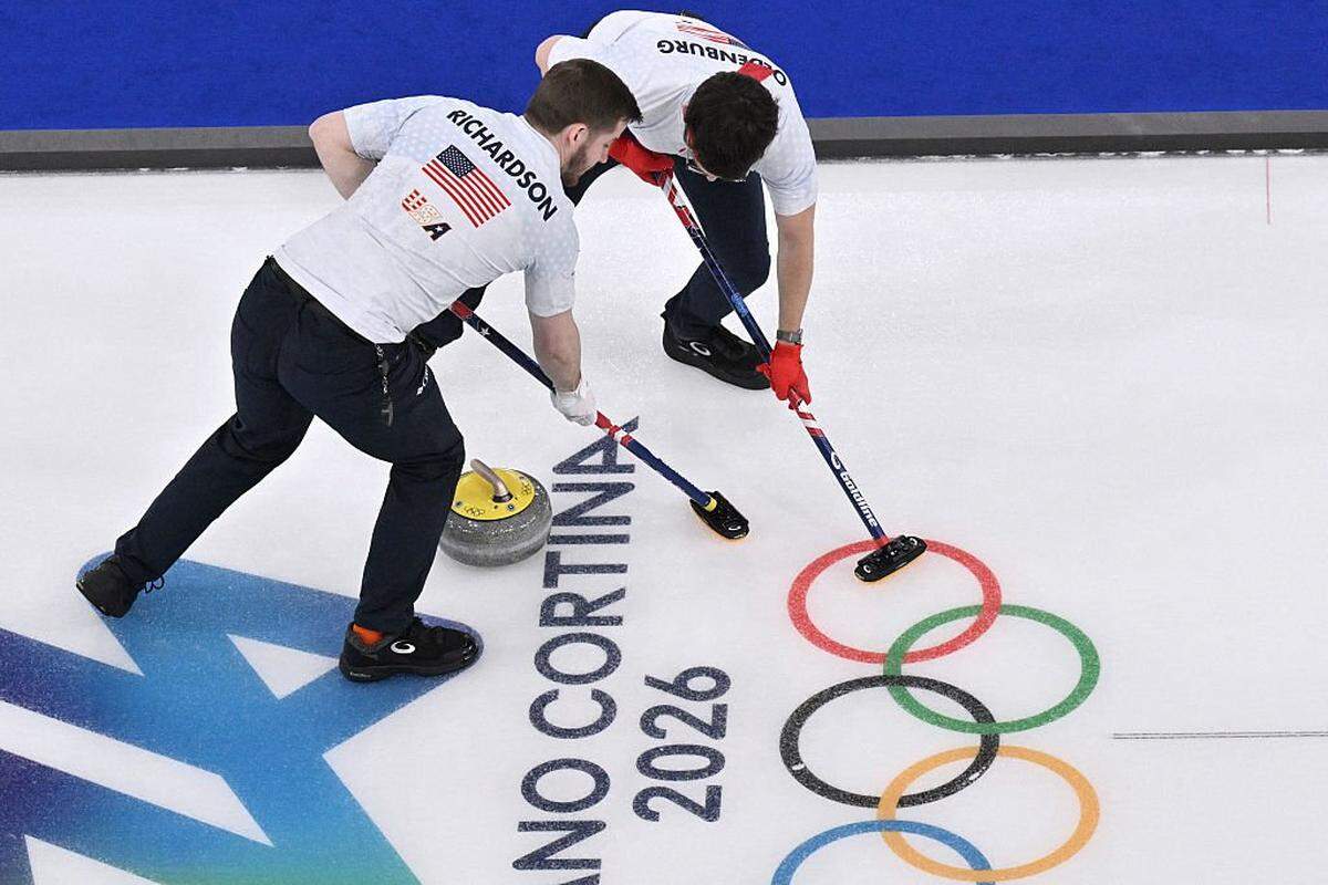 USA's Benjamin Richardson and USA's Aidan Oldenburg compete in the curling men's round robin between Germany and USA during the Milano Cortina 2026 Winter Olympic Games at the Cortina Curling Olympic Stadium in Cortina d'Ampezzo on Saturday.
