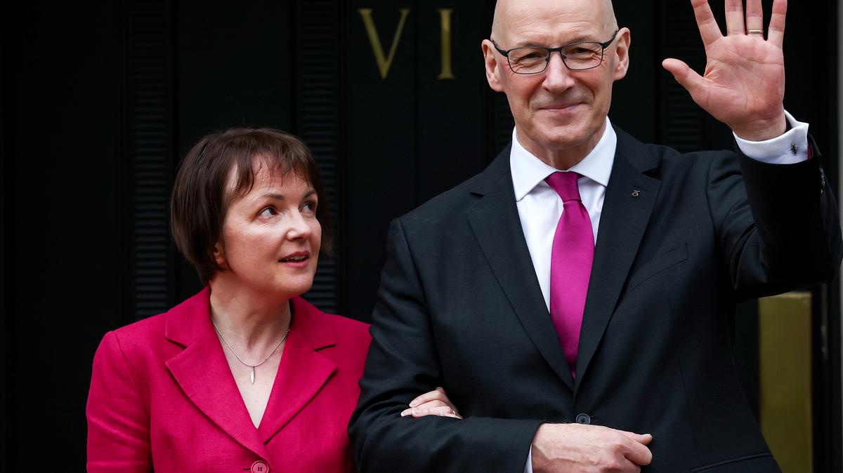 Scotland's new First Minister John Swinney stands on the steps of Bute House with his wife, Elizabeth Quigley, on May 7, 2024, in Edinburgh, Scotland. (Jeff J Mitchell/Getty Images/TNS)