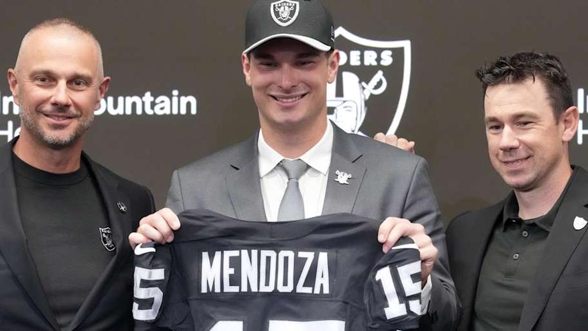  Apr 24, 2026; Henderson, NV, USA; Las Vegas Raiders quarterback Fernando Mendoza (center) poses with general manager John Spytek (left) and head coach Klint Kubiak at introductory press conference at Intermountain Health Performance Center after being selected as the No. 1 pick in the 2026 NFL Draft. Mandatory Credit: Kirby Lee-Imagn Images | Kirby Lee-Imagn Images 