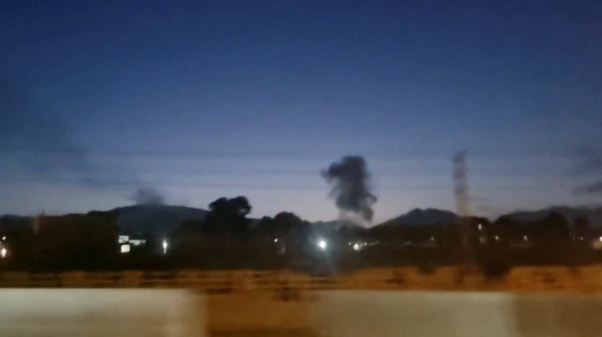A plume of smoke rises, as Iranian news agencies reported explosions were heard in several cities across the country, in Karaj, Iran in this screen grab obtained from social media video released June 11, 2026. Social Media/via REUTERS