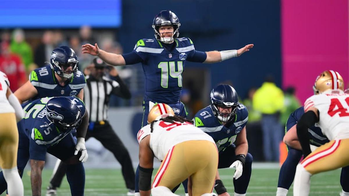  Jan 17, 2026; Seattle, WA, USA; Seattle Seahawks quarterback Sam Darnold (14) calls a play at the line of scrimmage against the San Francisco 49ers during the first half in an NFC Divisional Round game at Lumen Field. Mandatory Credit: Steven Bisig-Imagn Images | Steven Bisig-Imagn Images 