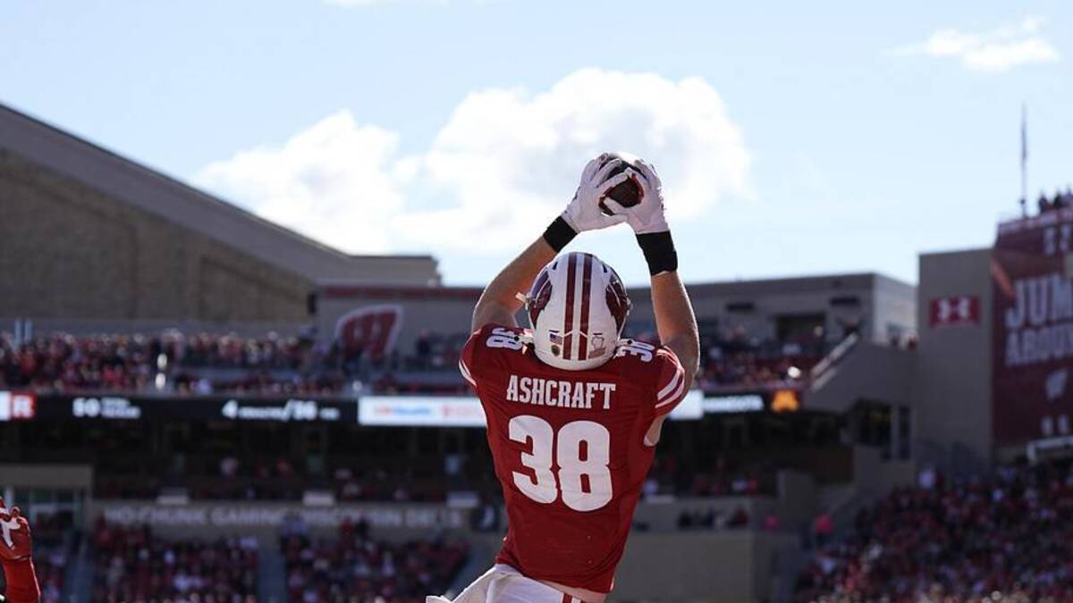  Oct 7, 2023; Madison, Wisconsin, USA; Wisconsin Badgers tight end Tucker Ashcraft (38) catches a pass to score a touchdown during the fourth quarter against the Rutgers Scarlet Knights at Camp Randall Stadium. Mandatory Credit: Jeff Hanisch-Imagn Images | Jeff Hanisch-Imagn Images 