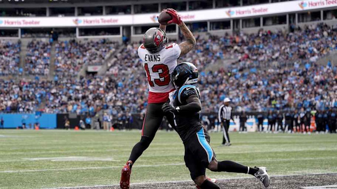  Dec 21, 2025; Charlotte, North Carolina, USA; Tampa Bay Buccaneers wide receiver Mike Evans (13) catches a touchdown against Carolina Panthers cornerback Mike Jackson (2) during the first half at Bank of America Stadium. Mandatory Credit: Jim Dedmon-Imagn Images | Jim Dedmon-Imagn Images 