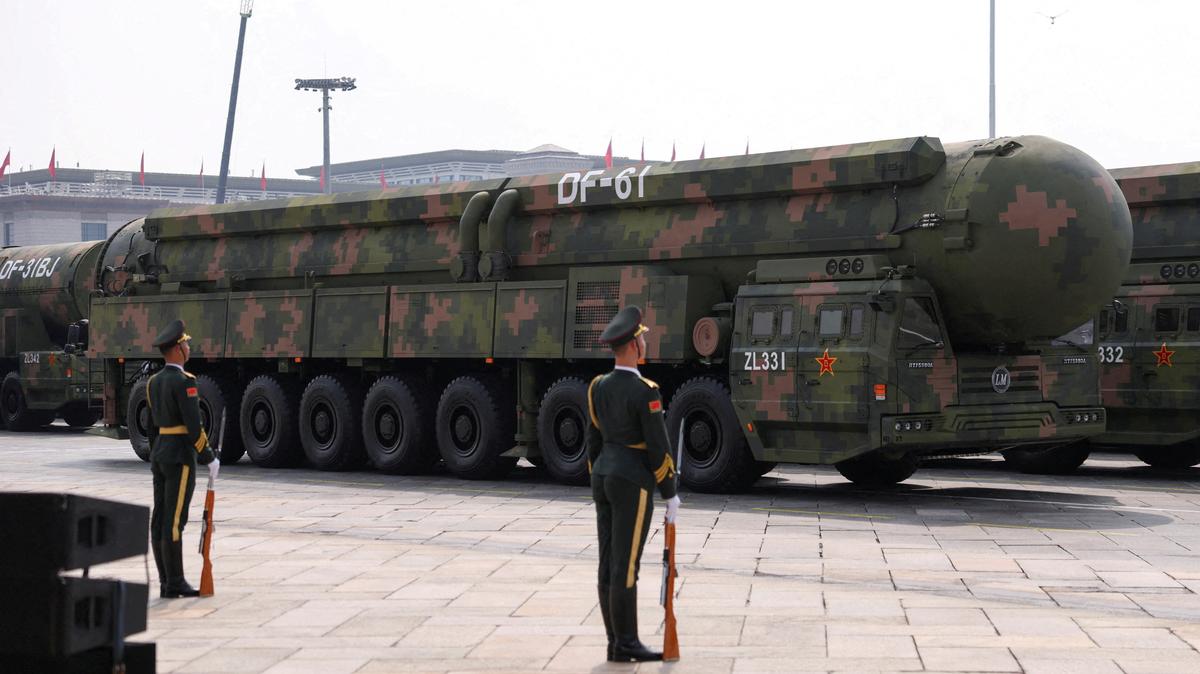 FILE PHOTO: Members of the People's Liberation Army stand as the strategic strike group displays DF-61 nuclear missiles during a military parade  in Beijing, China, September 3, 2025. REUTERS/Tingshu Wang/File Photo