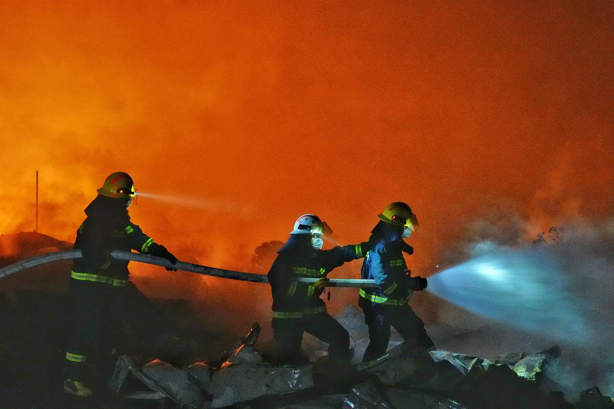 Firefighters work to extinguish a fire following a blast at a fireworks manufacturing factory in Liuyang, Hunan province, China, May 5, 2026. cnsphoto via REUTERS