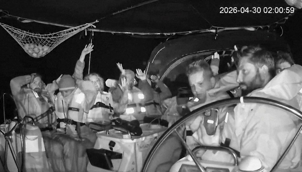 Attention Editors: This image has been cropped by Reuters to enhance quality, and an uncropped version has been provided separately.  CCTV footage shows crew members of the second flotilla that sailed from the Spanish port of Barcelona, carrying humanitarian aid to Palestinians in Gaza, raise their arms as the vessel is said to be intercepted by the Israeli Army, at a location given as at sea off the coast of Greece, April 30, 2026, in this screengrab taken from a handout video. Global Sumud Flotilla/Handout via REUTERS