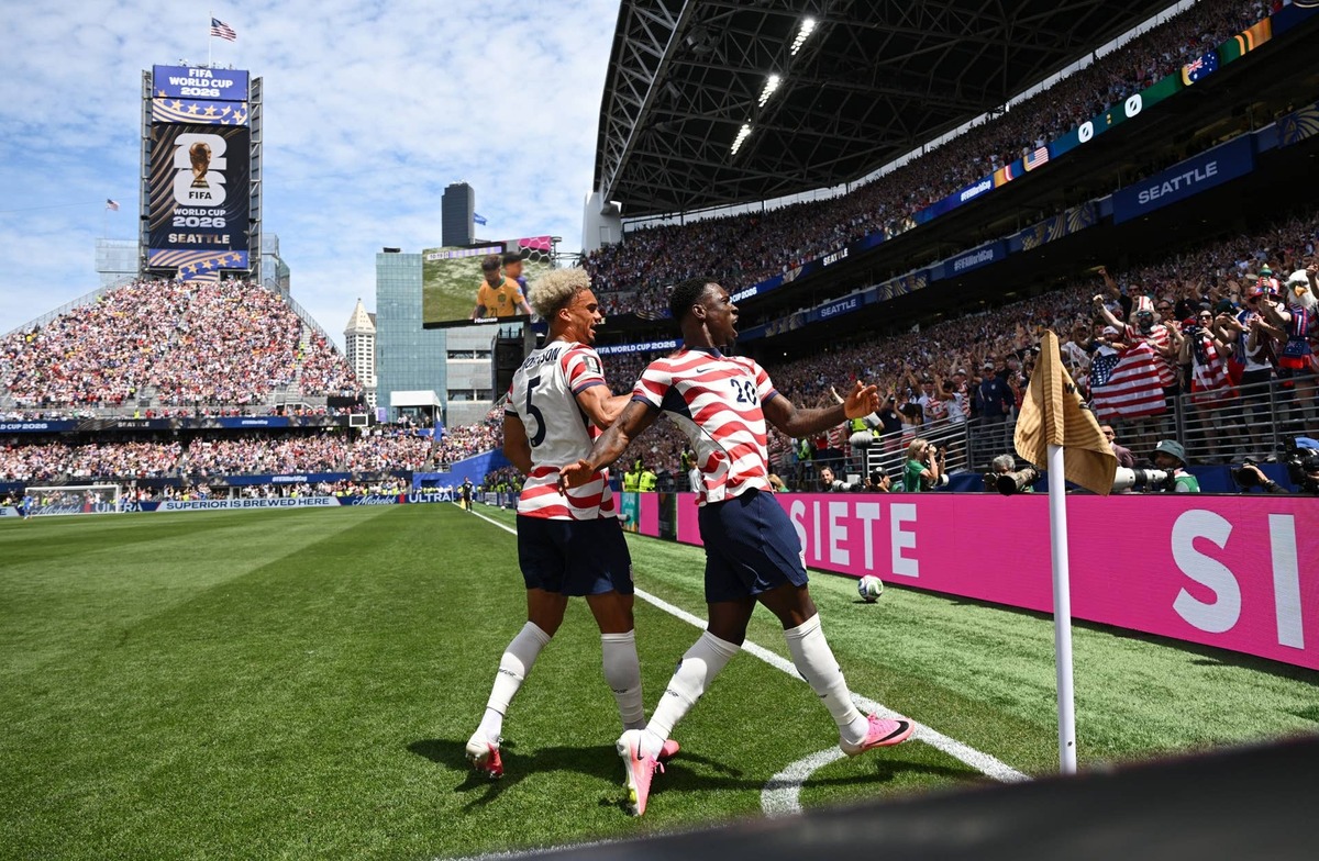  June 19, 2026; Seattle, Washington, U.S.; Folarin Balogun and Antonee Robinson of the U.S. celebrate after Australia's Cameron Burgess scores an own goal and the first goal for U.S. Mandatory Credit: Troy Wayrynen-Imagn Images