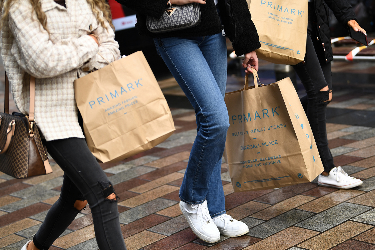 People carry Primark shopping bags in Belfast, Northern Ireland, May 4, 2021. REUTERS/Clodagh Kilcoyne