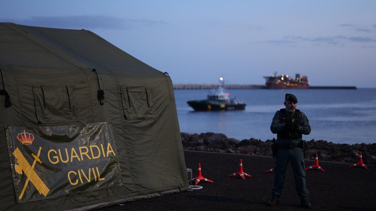 A member of the Spanish Civil Guard stands guard at the port of Granadilla de Abona, where the cruise ship MV Hondius is expected to dock after being affected by a hantavirus outbreak, in Tenerife, Spain, May 9, 2026. REUTERS/Hannah McKay