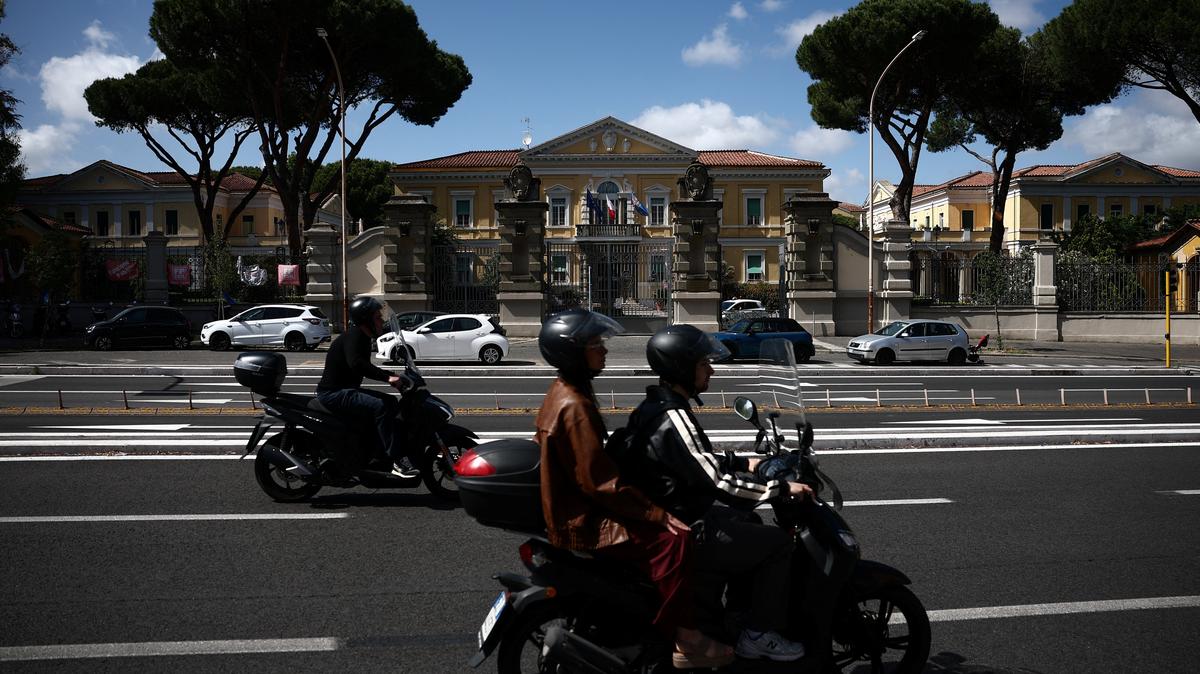 People drive past the entrance to the Spallanzani infectious disease hospital where biological samples from an Italian man placed in quarantine after coming into contact with a woman who died of Hantavirus will be examined in Rome, Italy, May 12, 2026. REUTERS/Guglielmo Mangiapane