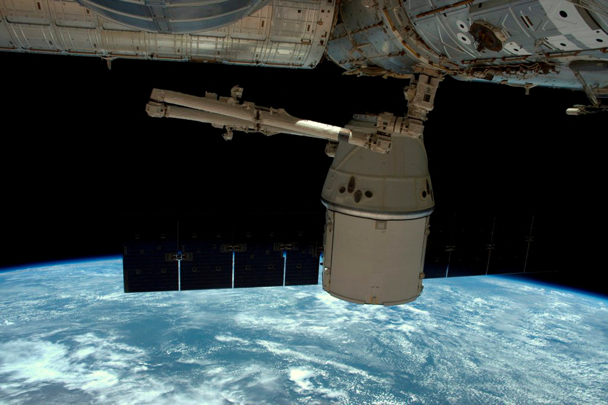 FILE PHOTO: A NASA photo shows a SpaceX Dragon capsule as it is released from the International Space Station in this image released to social media on May 11, 2016. Courtesy NASA/Handout via REUTERS/File Photo