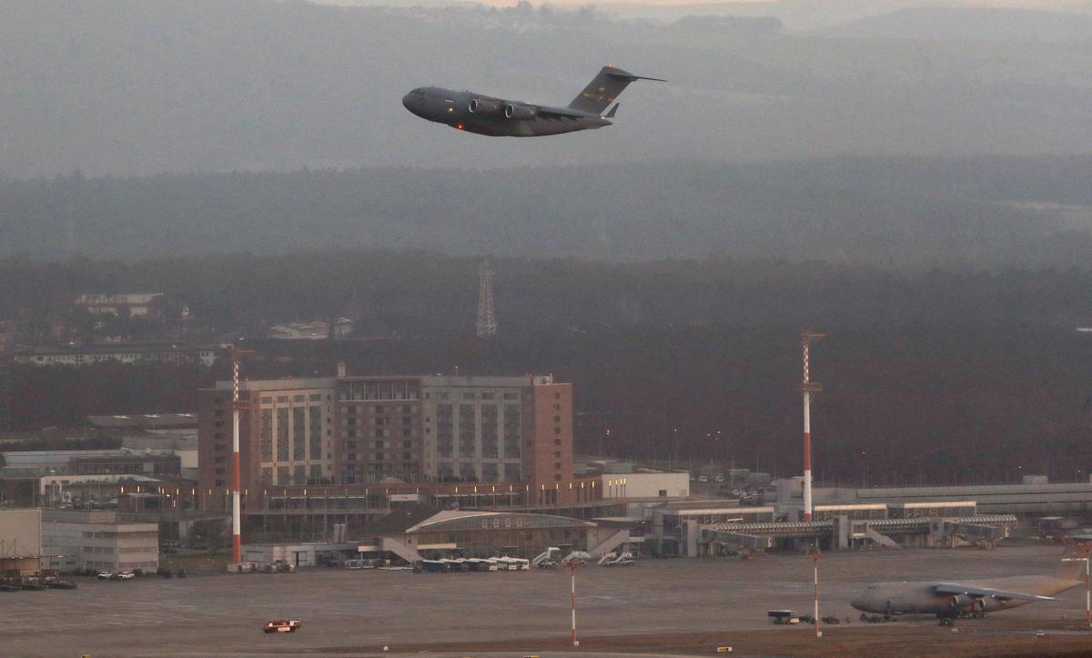 FILE PHOTO: A U.S. military aircraft takes off from the U.S. airbase in Ramstein, Germany February 5, 2022. REUTERS/Arnd Wiegmann/File Photo