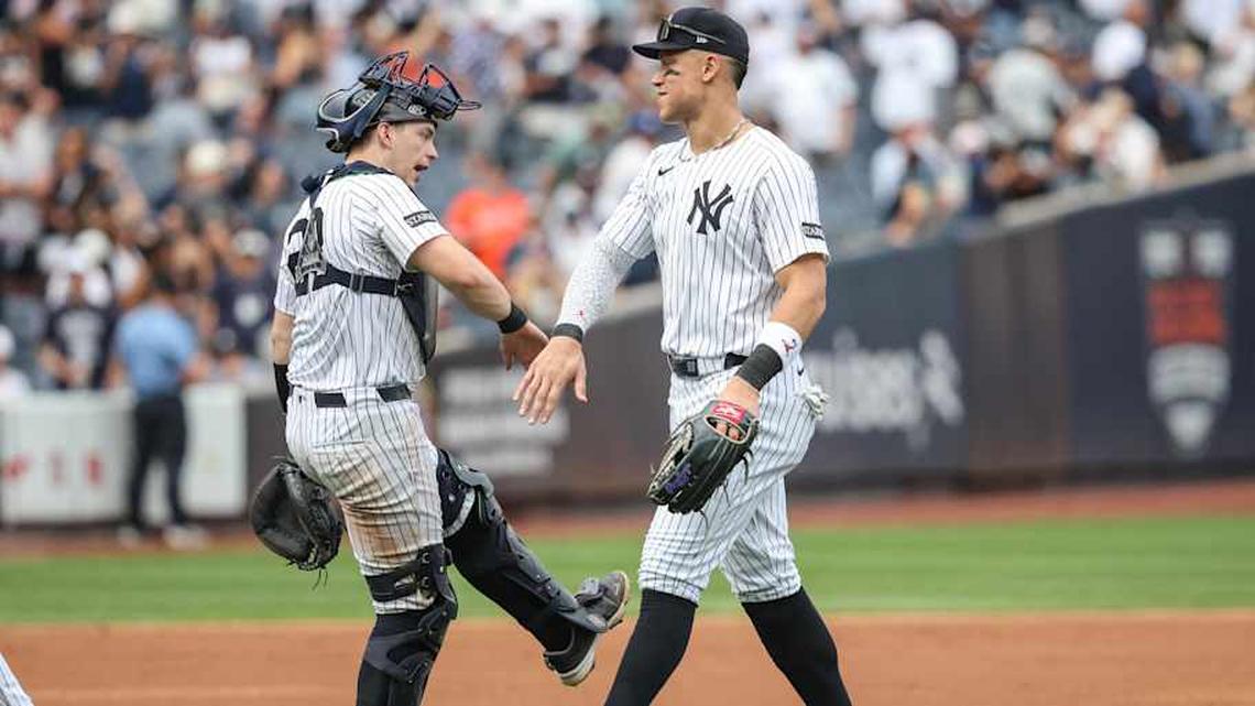  New York Yankees catcher Ben Rice (22) and right fielder Aaron Judge (99) celebrate after defeating the Baltimore Orioles 6-1 at Yankee Stadium. | Wendell Cruz-Imagn Images 