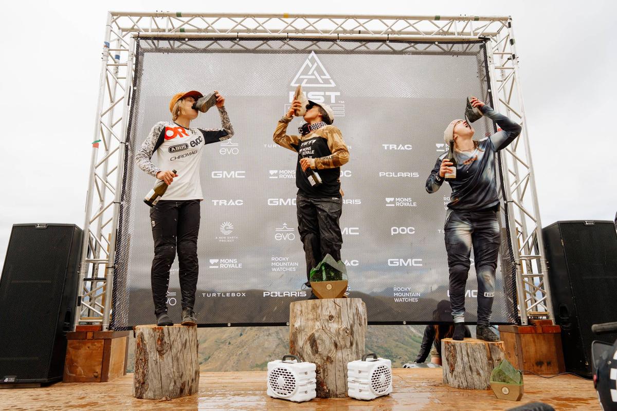 Kirsten, Robin, and HB takin' a shoe-y on the podium like the champs they are. .