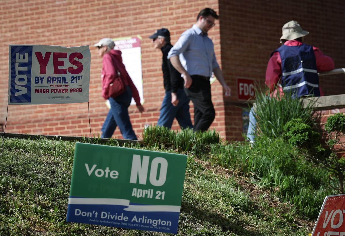  Voters arrive before casting their ballots at a polling location at the Westover Library on April 21, 2026, in Arlington, Virginia. Virginia voters will decide today on a statewide ballot question on whether to allow the Virginia General Assembly to redraw congressional districts, which could affect how the state's U.S. House districts are mapped in upcoming elections and shift political balance. (Photo by Win McNamee/Getty Images) 