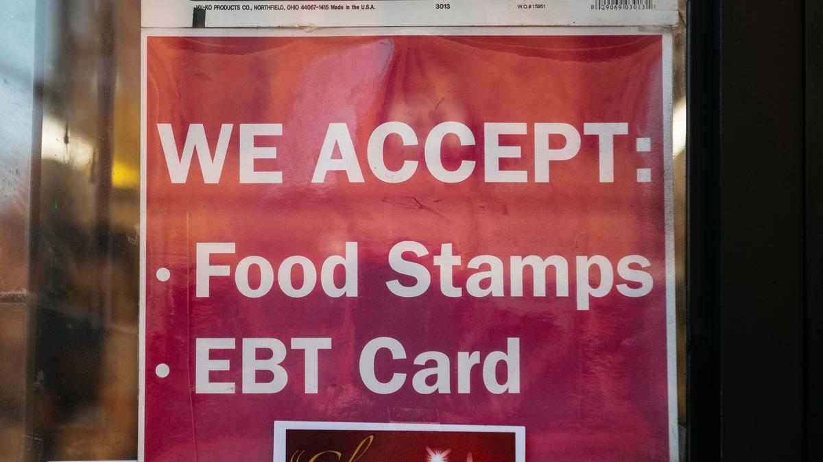 A sign alerting customers about SNAP food stamps benefits is displayed at a Brooklyn grocery store in New York City.
