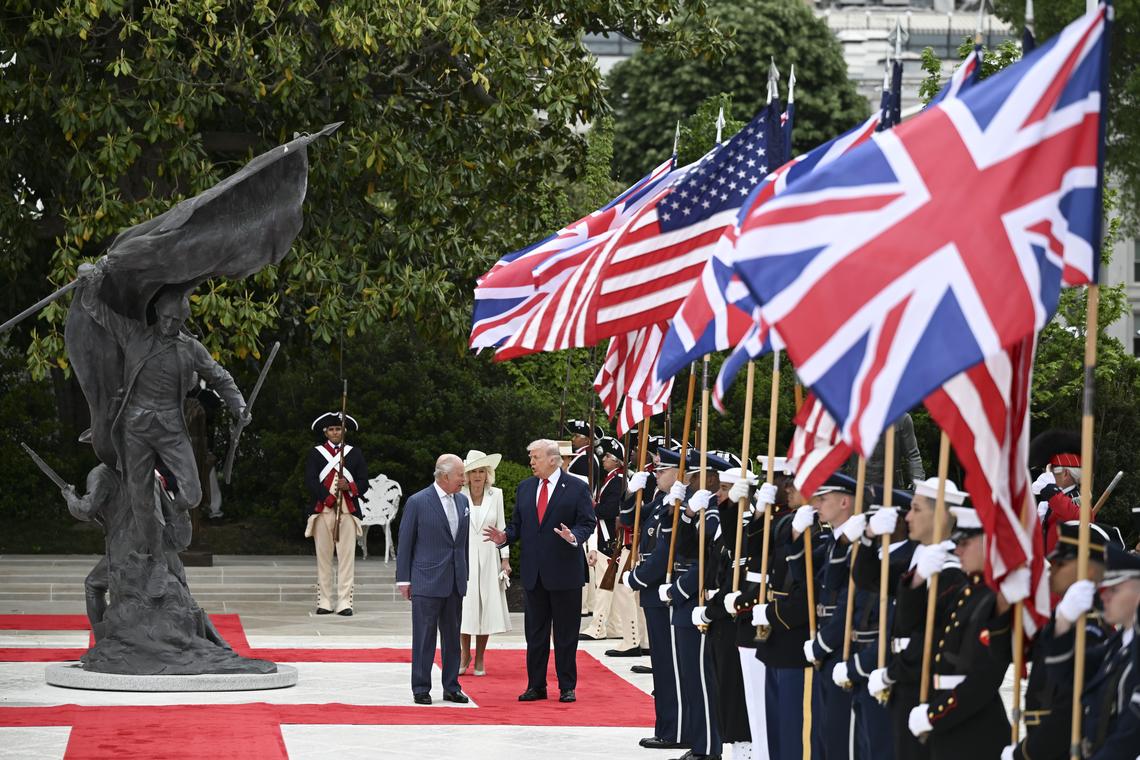 President Donald Trump, right, talks with King Charles III as Queen Camilla, center, and first lady Melania Trump follow in the Rose Garden during an arrival ceremony at the White House in Washington, on Tuesday, April 28, 2026. (Kenny Holston/The New York Times)