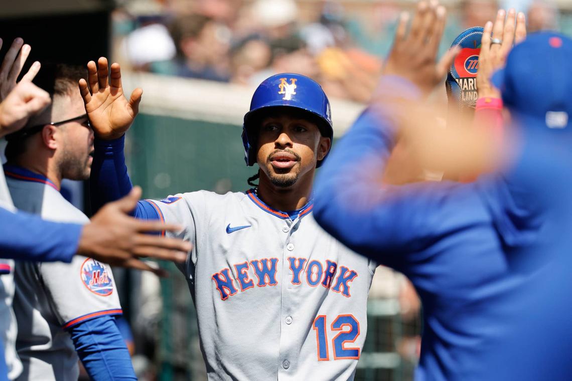  Sep 3, 2025; Detroit, Michigan, USA; New York Mets shortstop Francisco Lindor (12) receives congratulations from teammates after scoring in the third inning against the Detroit Tigers at Comerica Park. Mandatory Credit: Rick Osentoski-Imagn Images 