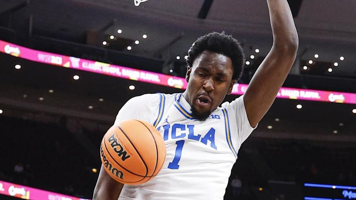  Mar 12, 2026; Chicago, IL, USA; UCLA Bruins center Xavier Booker (1) scores against the Rutgers Scarlet Knights during the second half at United Center. Mandatory Credit: Kamil Krzaczynski-Imagn Images | Kamil Krzaczynski-Imagn Images 