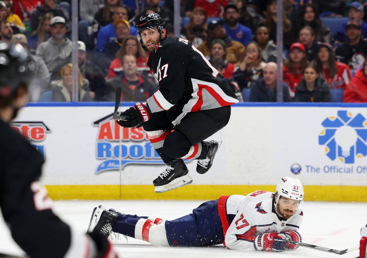  Buffalo Sabres left wing Jason Zucker (17) jumps after making a pass to avoid Washington Capitals defenseman Timothy Liljegren (27) Timothy T. Ludwig-Imagn Images