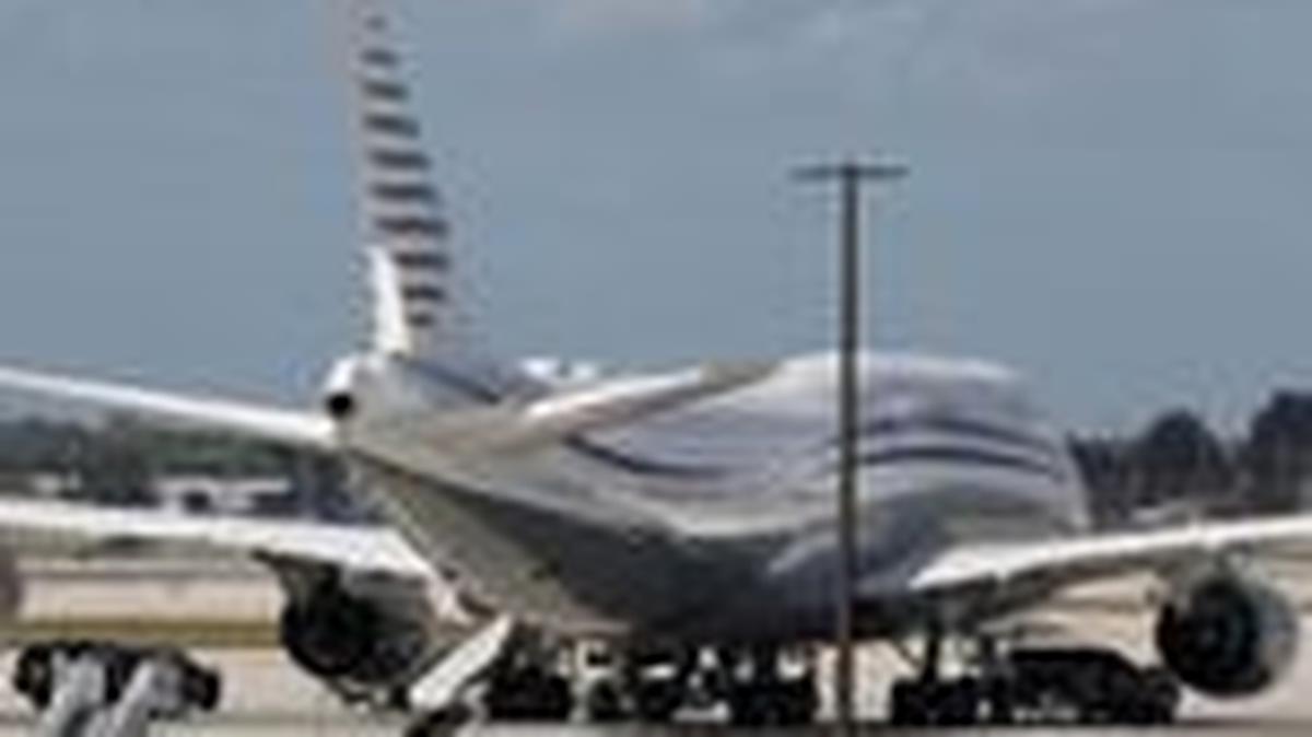 FILE PHOTO: The motorcade of U.S. President Donald Trump is parked next to a 12-year-old Qatari-owned Boeing 747-8 that Trump was touring in West Palm Beach, Florida, U.S., February 15, 2025. REUTERS/Kevin Lamarque/File Photo