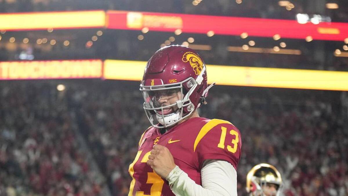  Nov 26, 2022; Los Angeles, California, USA; Southern California Trojans quarterback Caleb Williams (13) rushes for a touchdown in the second half against the Notre Dame Fighting Irish at United Airlines Field at Los Angeles Memorial Coliseum. Mandatory Credit: Kirby Lee-Imagn Images | Kirby Lee-Imagn Images 