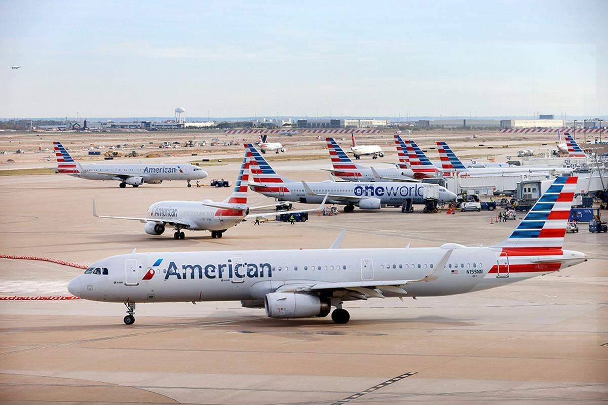 An American Airlines jet taxis to the runway after leaving a Terminal C gate at Dallas Fort Worth International Airport on Nov. 27, 2023.
