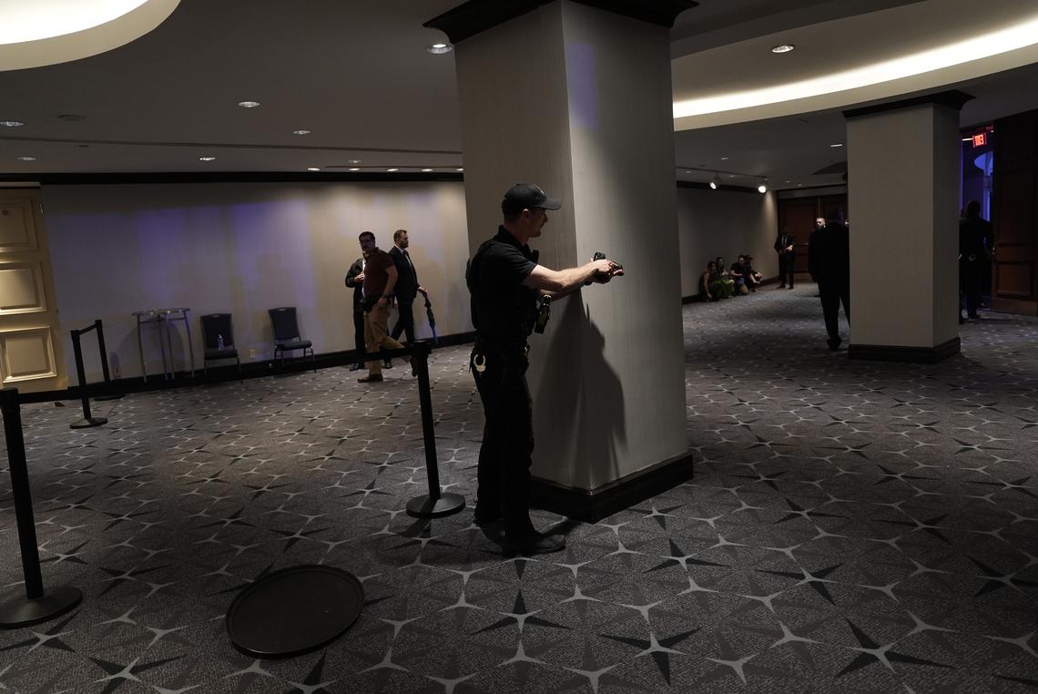 A law enforcement officer took up a position after gunfire was heard at the at the 2026 White House Correspondents' Association Dinner at the Washington Hilton on Saturday, April 25, 2026. A gunman carrying multiple weapons attempted to break into the dinner that President Trump was attending. Police have taken a suspect into custody. (Salwan Georges/The New York Times)