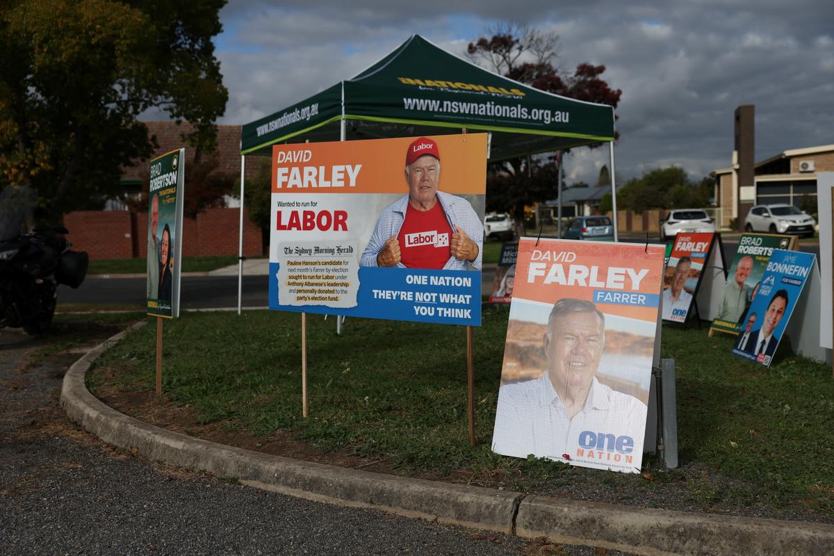 Campaign signs depicting One Nation candidate David Farley are displayed outside a pre-polling centre ahead of the Farrer by-election in Albury, Australia, May 6, 2026. REUTERS/Hollie Adams
