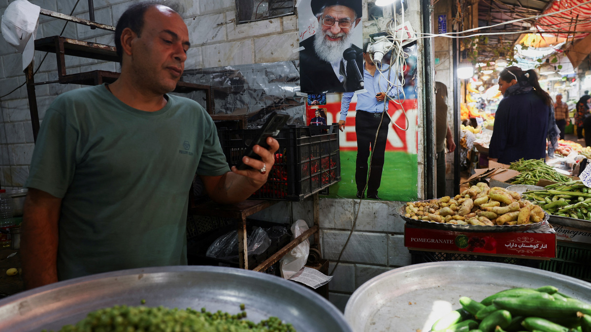 A picture of the late Iranian Supreme Leader Ayatollah Ali Khamenei is displayed on Thursday at a store in a local market in Tehran, Iran.