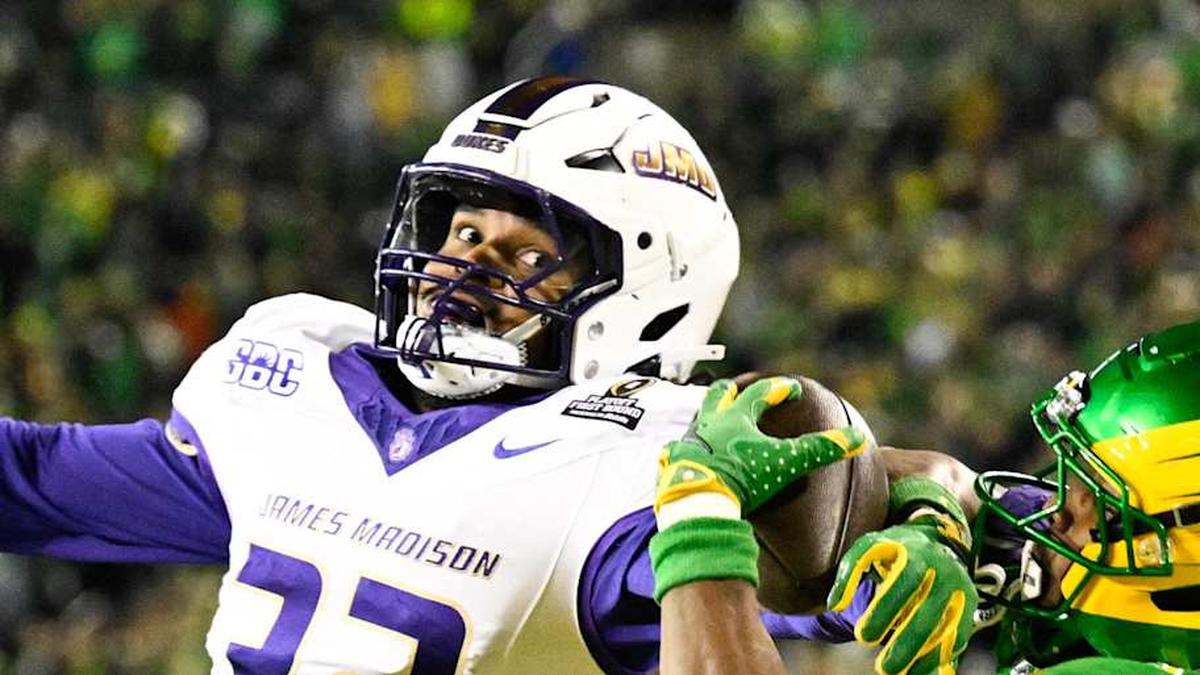  Dec 20, 2025; Eugene, OR, USA; Oregon Ducks wide receiver Jeremiah McClellan (11) makes a catch for a touchdown as James Madison Dukes defensive back DJ Barksdale (32) defends during the second quarter at Autzen Stadium. Mandatory Credit: Troy Wayrynen-Imagn Images | Troy Wayrynen-Imagn Images 