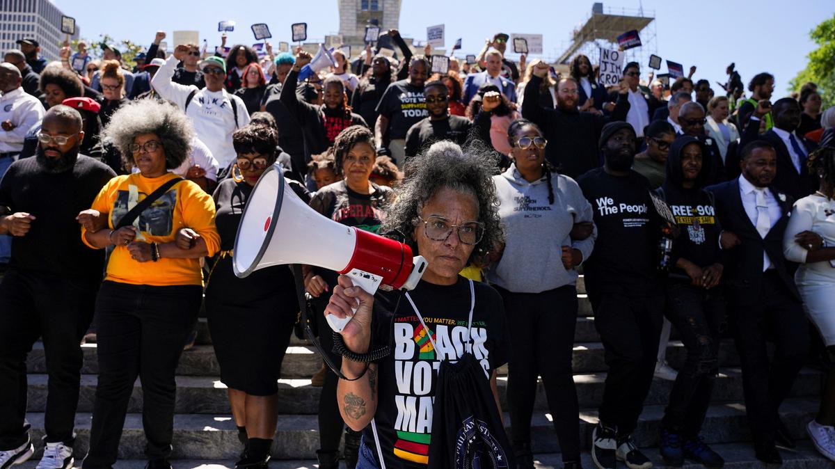 Demonstrators, including Democratic state House representatives and senators, walk down stairs outside the Tennessee state Capitol following passage of a new congressional map by the Republican majority on the final day of a special session in Nashville, Tennessee, U.S., May 7, 2026. REUTERS/Seth Herald