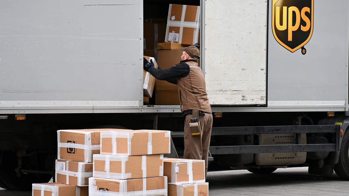 UPS. File photo: a UPS package delivery person takes parcels out of a truck.