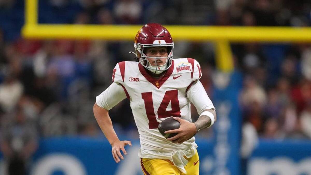 Dec 30, 2025; San Antonio, TX, USA; Southern California Trojans quarterback Jayden Maiava (14) carries the ball against the TCU Horned Frogs in the second half during the Alamo Bowl at Alamodome. Mandatory Credit: Kirby Lee-Imagn Images | Kirby Lee-Imagn Images 
