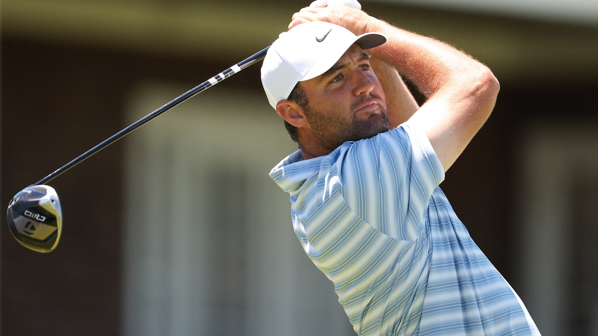 Jun 15, 2026; Southampton, New York, USA; Scottie Scheffler plays a tee shot on hole 14 during a practice round for the U.S. Open golf tournament. Mandatory Credit: Bill Streicher-Imagn Images