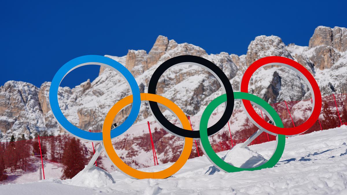 The Olympic rings are seen under a blue sky at Cortina D’Ampezzo, Italy, on Feb. 8, 2026. 