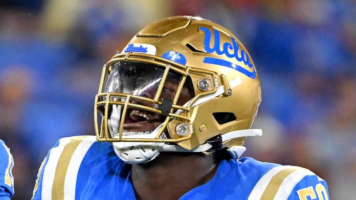  Oct 29, 2022; Pasadena, California, USA; UCLA Bruins linebacker Laiatu Latu (15) and defensive lineman Gary Smith III (58) celebrate after a sack of Stanford Cardinal quarterback Tanner McKee (18) in the first half at the Rose Bowl. Mandatory Credit: Jayne Kamin-Oncea-Imagn Images | Jayne Kamin-Oncea-Imagn Images 