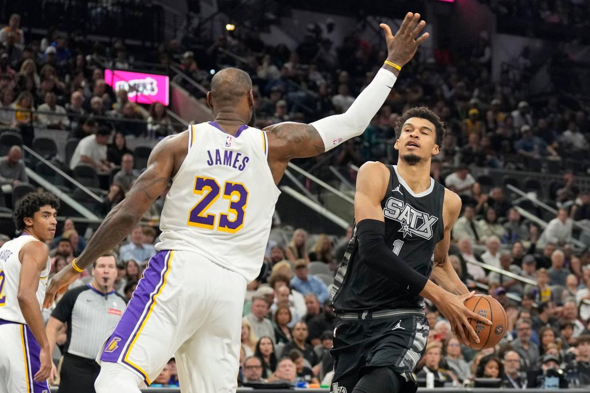  San Antonio Spurs center Victor Wembanyama drives to the basket past Los Angeles Lakers forward LeBron James. Scott Wachter-Imagn Images
